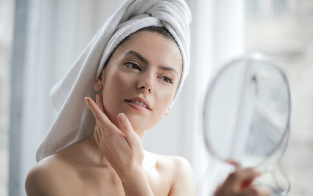 woman looking at mirror