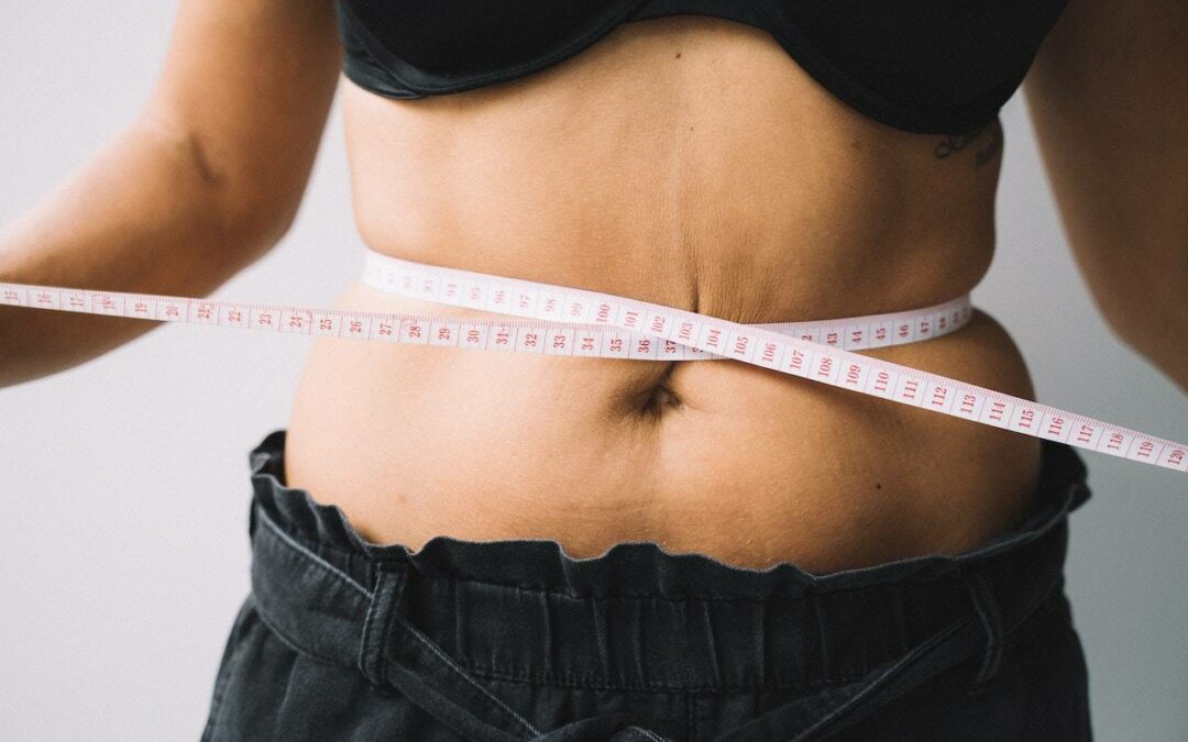 woman measuring waist