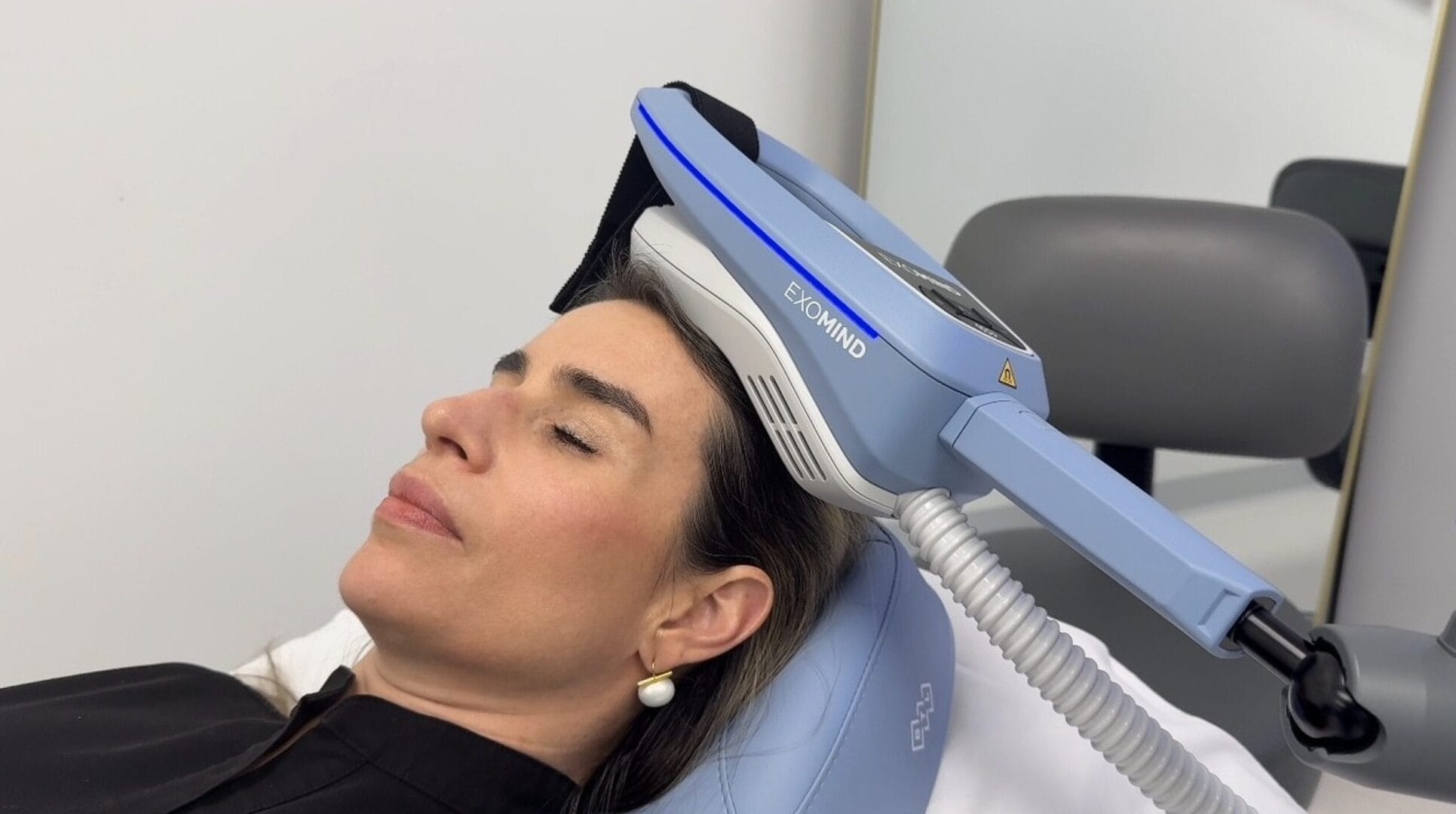 Exomind Treatment Woman in office receiving Exomind therapy treatments.